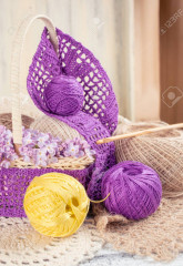 66286894-yarn-for-crochet-and-knitted-openwork-napkins-still-life-photo-with-tools-for-handmade.jpg